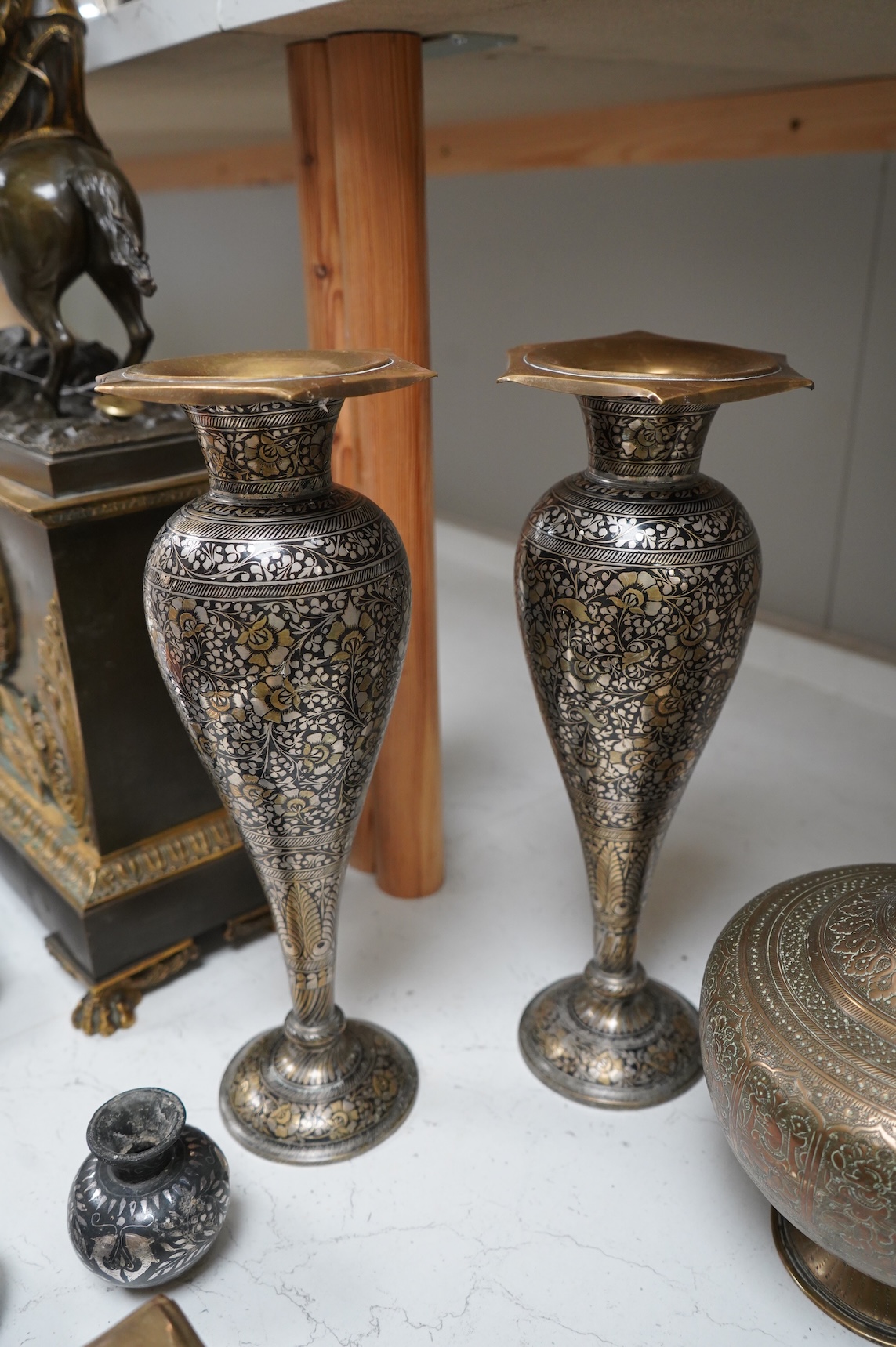 A collection of Indian brass and metalware to include a pierced casket box and Bidriware vases, largest 33cm high